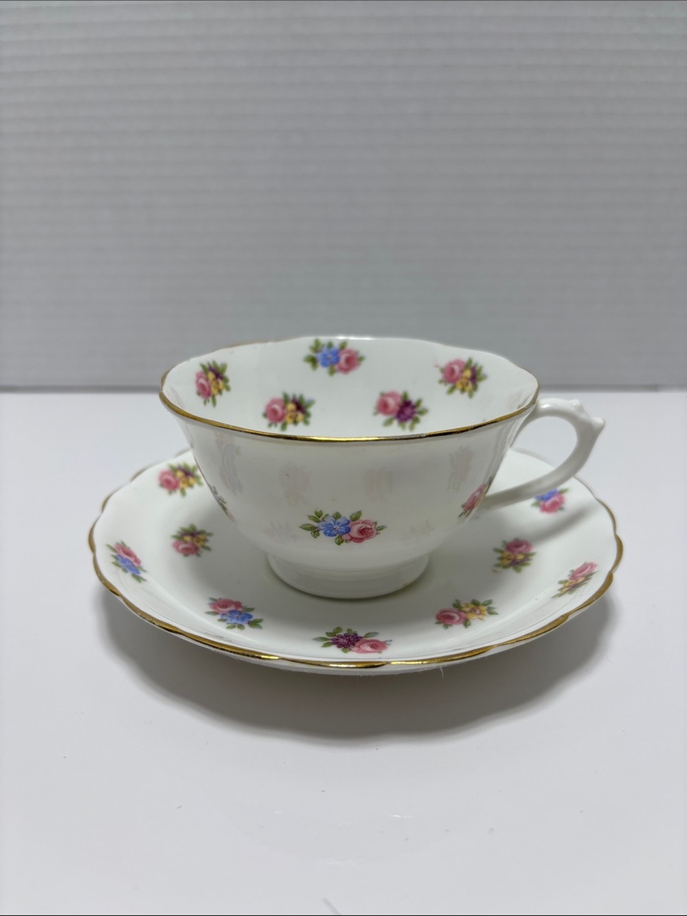 White Floral Bone China Teacup and Saucer with Gold Trim
